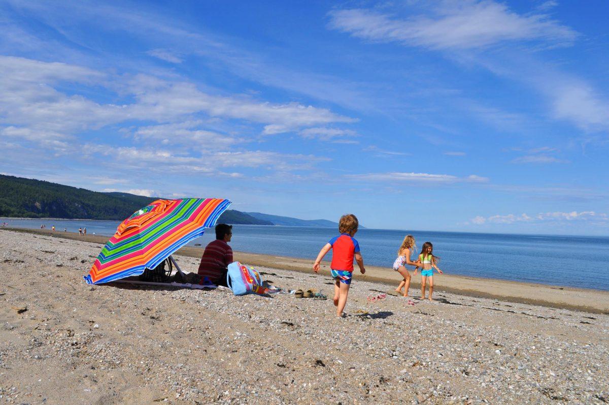 Family enjoying Saint-Irénée Beach in Charlevoix by the St. Lawrence River